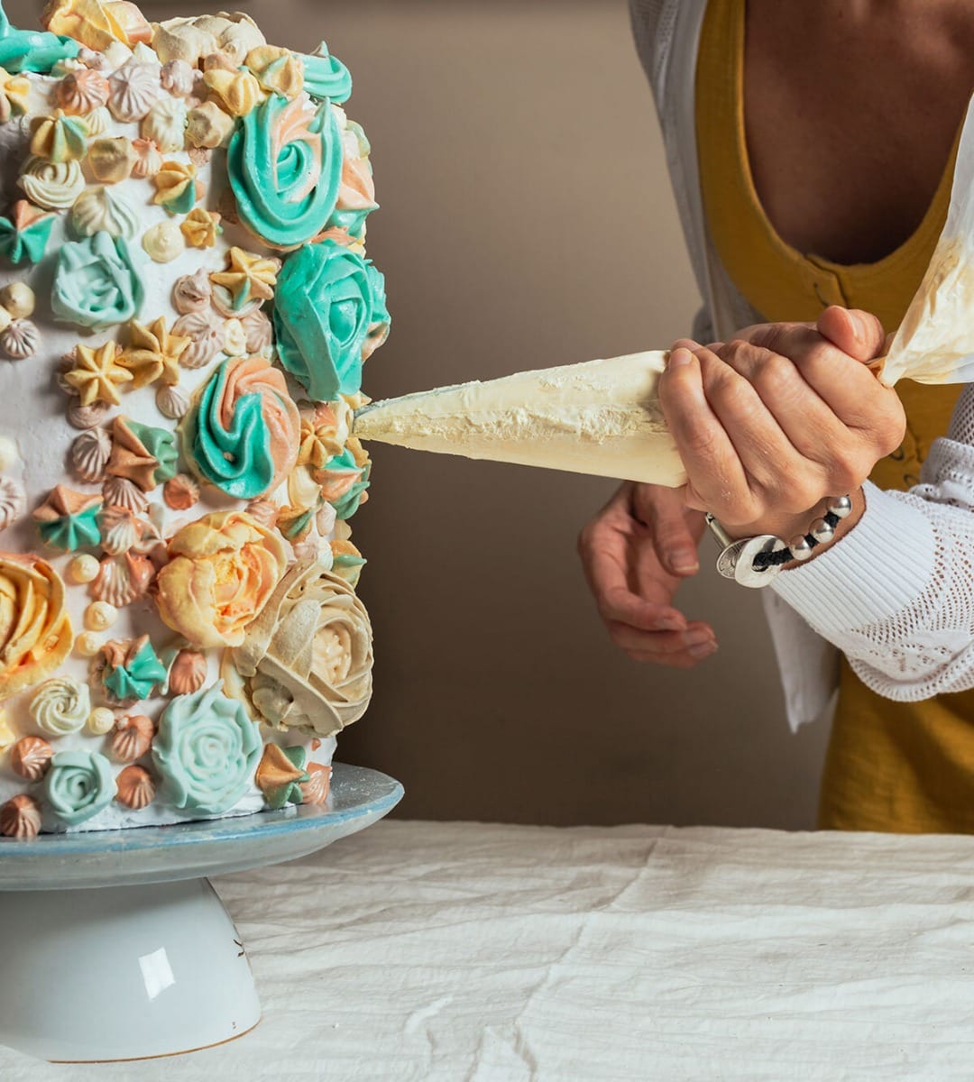 Pastry chef working with lab tools and decorations